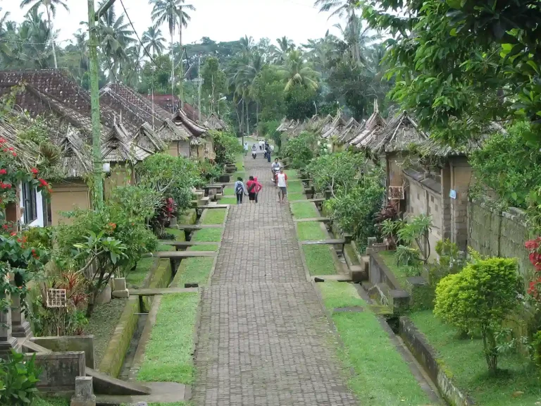 Visitors walking the paved lane of Penglipuran village, Bangli
