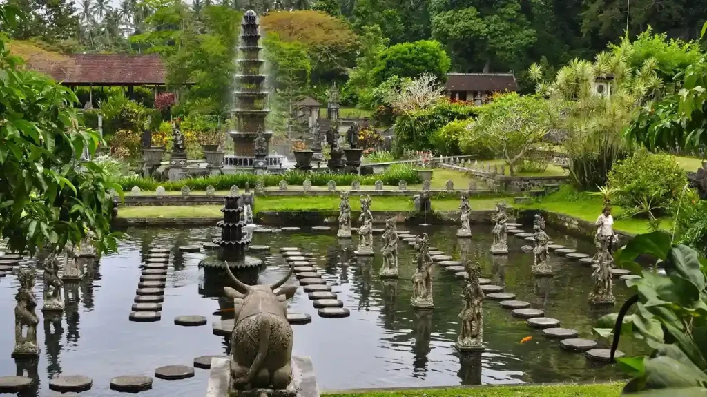 Stepping stones and statues in the pools of Tirta Gangga