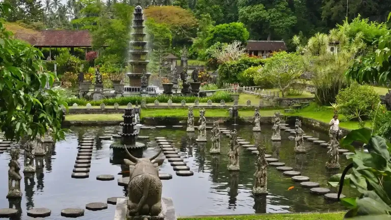 Stepping stones and statues in the pools of Tirta Gangga